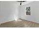 Empty bedroom with neutral tile floors, a ceiling fan and one window at 3807 Las Vegas Ave, North Port, FL 34288