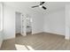 Bedroom with tile floors, ceiling fan and ensuite bathroom at 3807 Las Vegas Ave, North Port, FL 34288