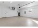 Clean garage with epoxy floor, bright lights, and utility connections at 3807 Las Vegas Ave, North Port, FL 34288