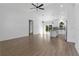 Spacious living room featuring tile floors, a ceiling fan and view into the kitchen at 3807 Las Vegas Ave, North Port, FL 34288