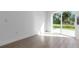 Open living space leads to outdoor patio through sliding glass doors at 3807 Las Vegas Ave, North Port, FL 34288