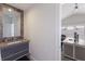 A pristine bathroom leads to a modern office with glass doors to a balcony outside at 3916 N Shell Rd, Sarasota, FL 34242