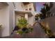 Charming home exterior with a landscaped walkway and manicured garden lighting up the path at 3916 N Shell Rd, Sarasota, FL 34242