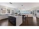 Open-concept kitchen with island, breakfast bar, modern appliances, and a scenic view at 3916 N Shell Rd, Sarasota, FL 34242