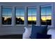 Bright living room featuring a bay window showcasing a beautiful sunset view at 3916 N Shell Rd, Sarasota, FL 34242