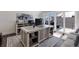 Spacious office with desk, shelving, and sliding doors to outside balcony with neighborhood views at 3916 N Shell Rd, Sarasota, FL 34242