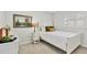 Charming bedroom with a white bed, shuttered windows, and decorative accents at 404 Cerromar N Cir # 119, Venice, FL 34293