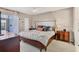 Cozy bedroom with a ceiling fan, comfortable bed, and tasteful decor at 404 Cerromar N Cir # 119, Venice, FL 34293