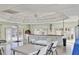 Spacious clubhouse room featuring ample seating, counter space, and abundant natural light at 404 Cerromar N Cir # 119, Venice, FL 34293