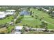 Expansive view of the golf course with water features, palm trees, and beautiful landscaping at 404 Cerromar N Cir # 119, Venice, FL 34293