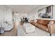 Open floor plan with living room featuring modern decor and view of dining and kitchen area at 404 Cerromar N Cir # 119, Venice, FL 34293