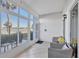 Enclosed porch area offering a tranquil view of the serene lake, perfect for relaxation and enjoying the outdoors at 404 Cerromar N Cir # 119, Venice, FL 34293