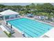 Aerial view of a large swimming pool with lap lanes and surrounding lounge area, a perfect amenity at 404 Cerromar N Cir # 119, Venice, FL 34293