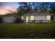 Charming single-story home with a well-maintained lawn and inviting entryway at 4062 Blitzen Ter, North Port, FL 34287