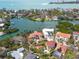 Stunning aerial of a waterfront neighborhood featuring luxurious houses and scenic water views at 4129 Roberts Point Cir, Sarasota, FL 34242