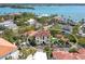 A captivating aerial view showing a waterfront home with a sparkling swimming pool at 4129 Roberts Point Cir, Sarasota, FL 34242