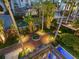 Overhead view of landscaped backyard with brick pathways, lush plants, and inviting pool area at 4129 Roberts Point Cir, Sarasota, FL 34242