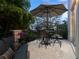 Inviting outdoor balcony offering seating, a view and mature plants at 4129 Roberts Point Cir, Sarasota, FL 34242