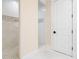 Bright bathroom featuring tiled floors, dual shower stalls, and contrasting colored accent wall at 4129 Roberts Point Cir, Sarasota, FL 34242