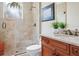 Well-lit bathroom with a glass-enclosed shower, marble vanity, and stylish fixtures at 4129 Roberts Point Cir, Sarasota, FL 34242