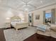 Bright bedroom featuring a decorative ceiling, a crystal chandelier, and beautiful hardwood floors at 4129 Roberts Point Cir, Sarasota, FL 34242
