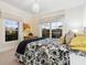 Inviting bedroom with natural light, featuring a large window and comfortable furnishings at 4129 Roberts Point Cir, Sarasota, FL 34242
