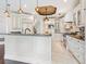 Spacious kitchen features an island with seating, modern appliances, and custom cabinetry at 4129 Roberts Point Cir, Sarasota, FL 34242