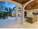 Stunning outdoor area with a covered patio, lounge seating, and a shimmering pool at 4129 Roberts Point Cir, Sarasota, FL 34242