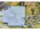 Aerial shot showcasing the roof and landscaping of the house, emphasizing its layout and surrounding greenery at 4220 Center Pointe Ln # 21, Sarasota, FL 34233