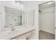 Ensuite bathroom with a large vanity and a walk-in closet at 4220 Center Pointe Ln # 21, Sarasota, FL 34233