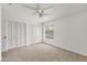 Bedroom with neutral carpet, a ceiling fan, and large closets at 4220 Center Pointe Ln # 21, Sarasota, FL 34233