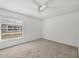 Bright bedroom with neutral carpet and a large window at 4220 Center Pointe Ln # 21, Sarasota, FL 34233