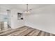 Bright dining area featuring laminate flooring and modern chandelier lighting at 4220 Center Pointe Ln # 21, Sarasota, FL 34233