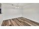 Clean dining area with laminate flooring and view to kitchen and modern lighting fixture at 4220 Center Pointe Ln # 21, Sarasota, FL 34233