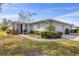 Well-kept single-story home featuring an attached garage and a tidy front yard at 4220 Center Pointe Ln # 21, Sarasota, FL 34233