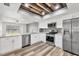 Well-lit kitchen with stainless appliances, granite counters and access to an outdoor view at 4220 Center Pointe Ln # 21, Sarasota, FL 34233