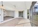 Bright lanai with tiled floor, sliding glass doors to the interior, and a screened enclosure for enjoying the outdoors at 4220 Center Pointe Ln # 21, Sarasota, FL 34233