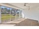 Enclosed lanai with brick floors, a ceiling fan, and large windows with great natural light at 4220 Center Pointe Ln # 21, Sarasota, FL 34233