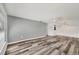 Spacious living room featuring modern laminate flooring and a ceiling fan at 4220 Center Pointe Ln # 21, Sarasota, FL 34233