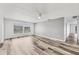 Bright living room featuring neutral paint, laminate flooring, and a large window at 4220 Center Pointe Ln # 21, Sarasota, FL 34233