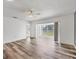 Living room features lots of natural light, a ceiling fan and sliding door access to the backyard at 4220 Center Pointe Ln # 21, Sarasota, FL 34233