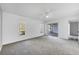 Spacious main bedroom with neutral carpet, a ceiling fan, and sliding glass doors to the lanai at 4220 Center Pointe Ln # 21, Sarasota, FL 34233