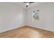 Well-lit bedroom with wood-look flooring, a ceiling fan, and a bright window at 4240 Adelaide Ave, North Port, FL 34288