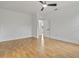 Light-filled bedroom with neutral walls, wood-look floors, and ensuite access at 4240 Adelaide Ave, North Port, FL 34288