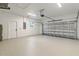 Spacious garage with an automatic door, clean white walls, and epoxy floor at 4240 Adelaide Ave, North Port, FL 34288