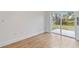 Bright room with a sliding glass door leading to a patio and backyard at 4240 Adelaide Ave, North Port, FL 34288