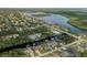 An aerial view of a waterfront community with lush vegetation and direct water access at 4386 Library St, Port Charlotte, FL 33948