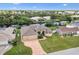 Picturesque aerial shot of a landscaped home, complete with three-car garage and a serene canal setting at 4386 Library St, Port Charlotte, FL 33948