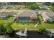 A private backyard features a screened-in pool and a boat dock and lift on the canal at 4386 Library St, Port Charlotte, FL 33948