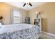 Inviting bedroom with soft lighting, ceiling fan, and well-decorated furnishings at 4386 Library St, Port Charlotte, FL 33948